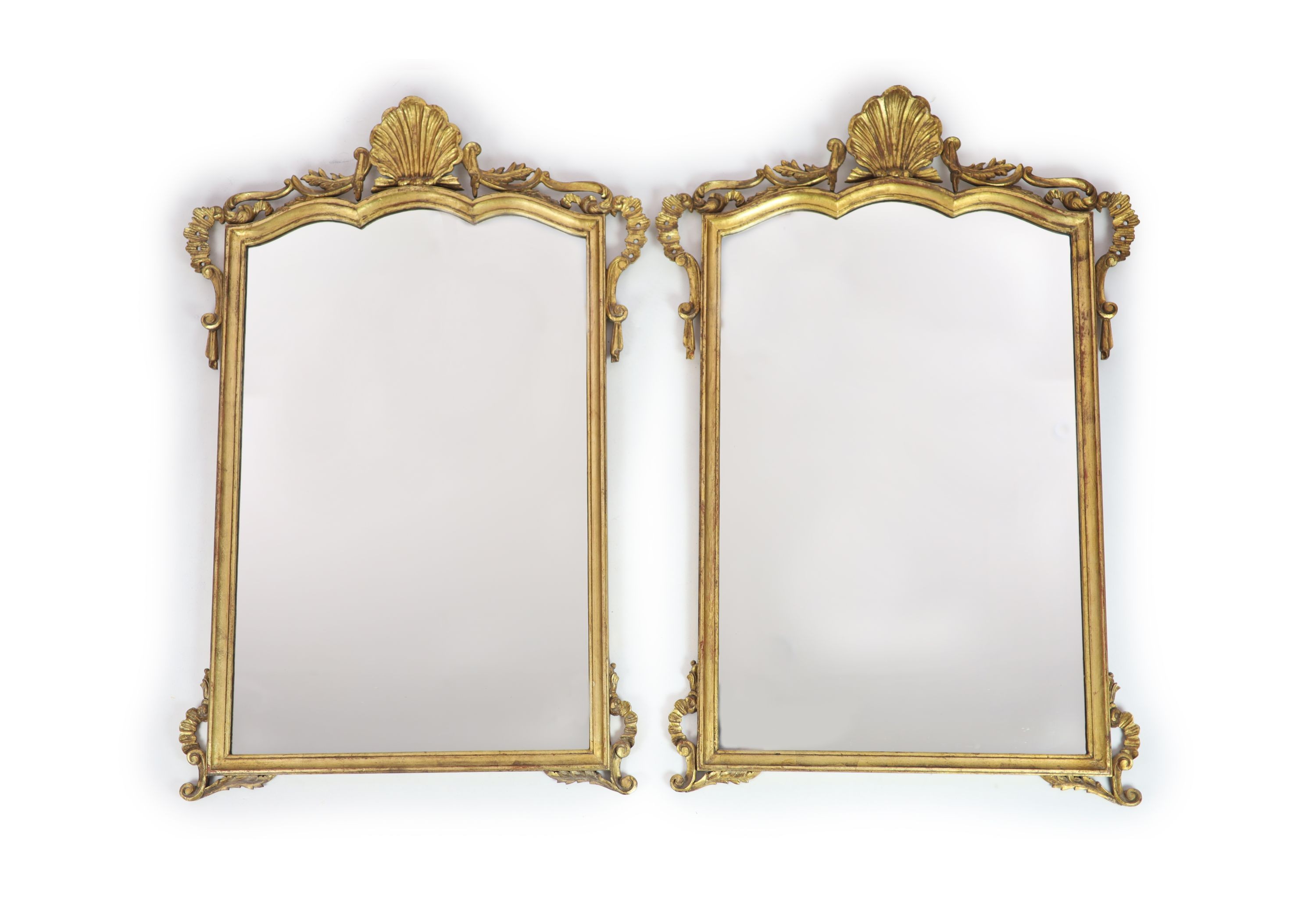 A pair of Georgian style carved giltwood wall mirrors
